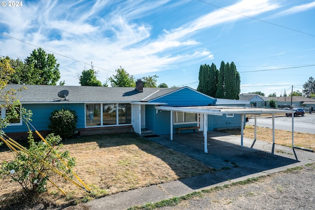 view of front of house with a carport