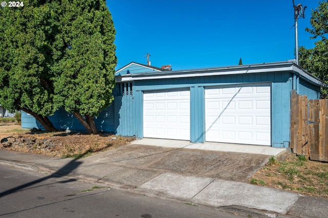 detached garage with fence