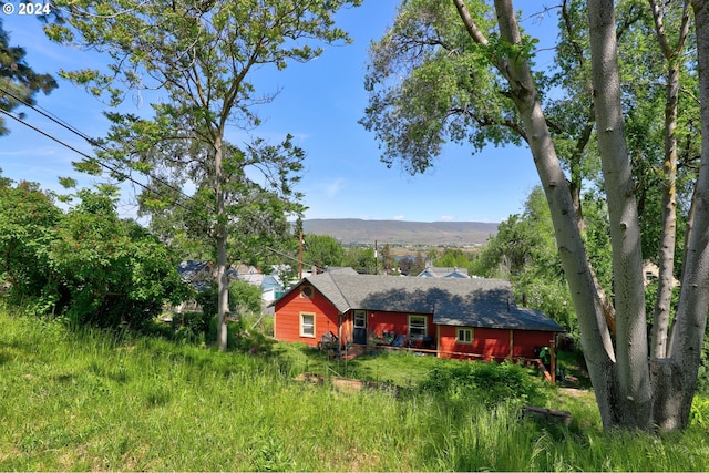 back of property featuring a mountain view