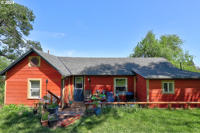 view of front of home with a shingled roof