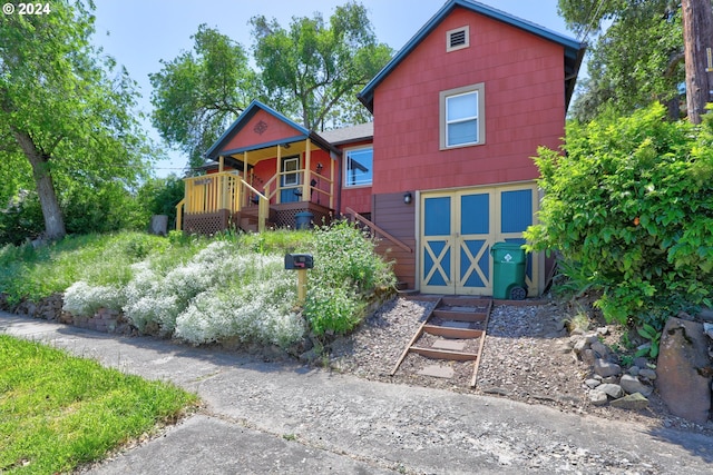 view of front of house with stairs