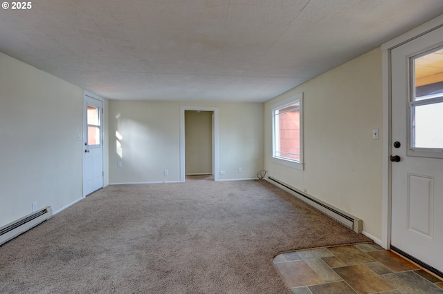 interior space featuring a baseboard radiator, baseboards, and dark colored carpet