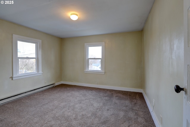 carpeted spare room with baseboards, a baseboard radiator, and a healthy amount of sunlight