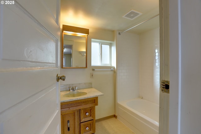 full bathroom with visible vents, baseboards, shower / tub combination, tile patterned floors, and vanity