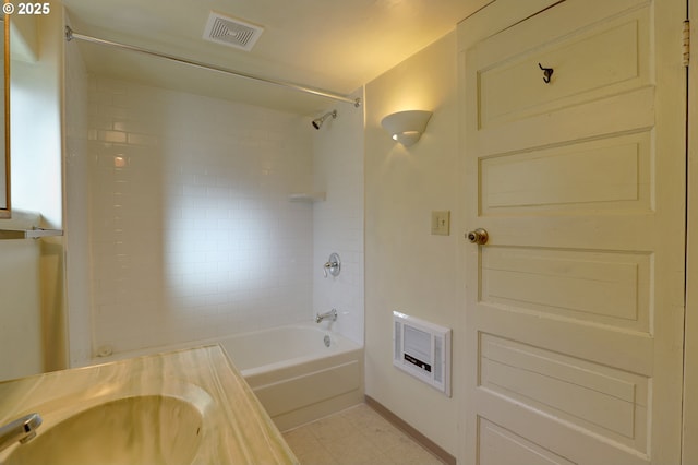 bathroom with tub / shower combination, a sink, and visible vents