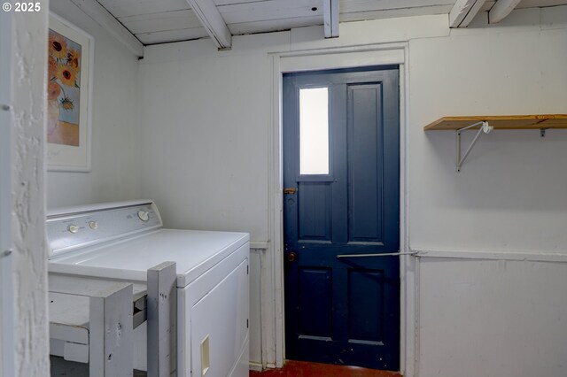 clothes washing area featuring washer / dryer and laundry area