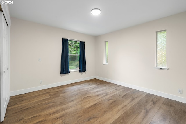 spare room featuring hardwood / wood-style floors