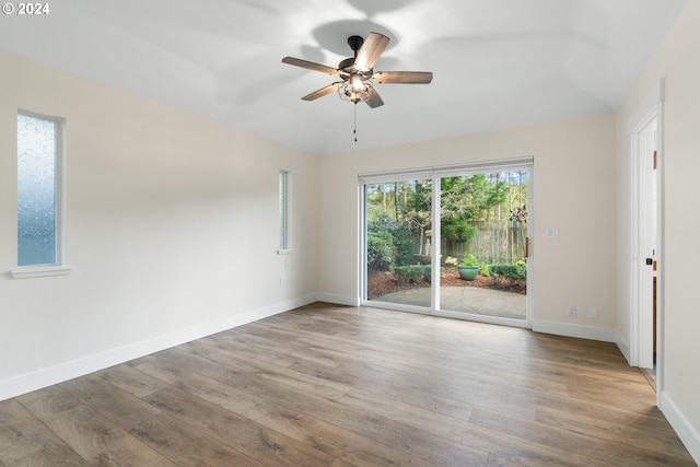 spare room featuring wood-type flooring and ceiling fan