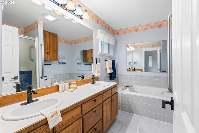 bathroom with vanity and an enclosed shower