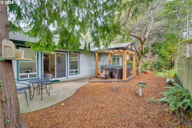 view of yard with a patio area and a hot tub