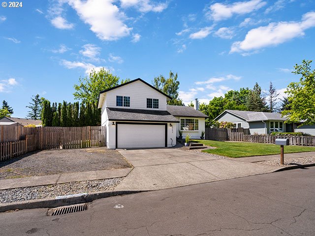 view of front property with a front yard and a garage