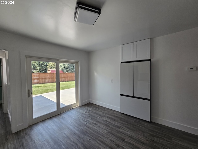 unfurnished room with dark hardwood / wood-style floors