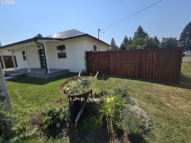 view of property exterior with a lawn