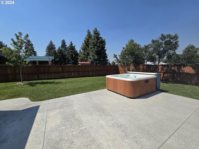 view of patio / terrace with a hot tub