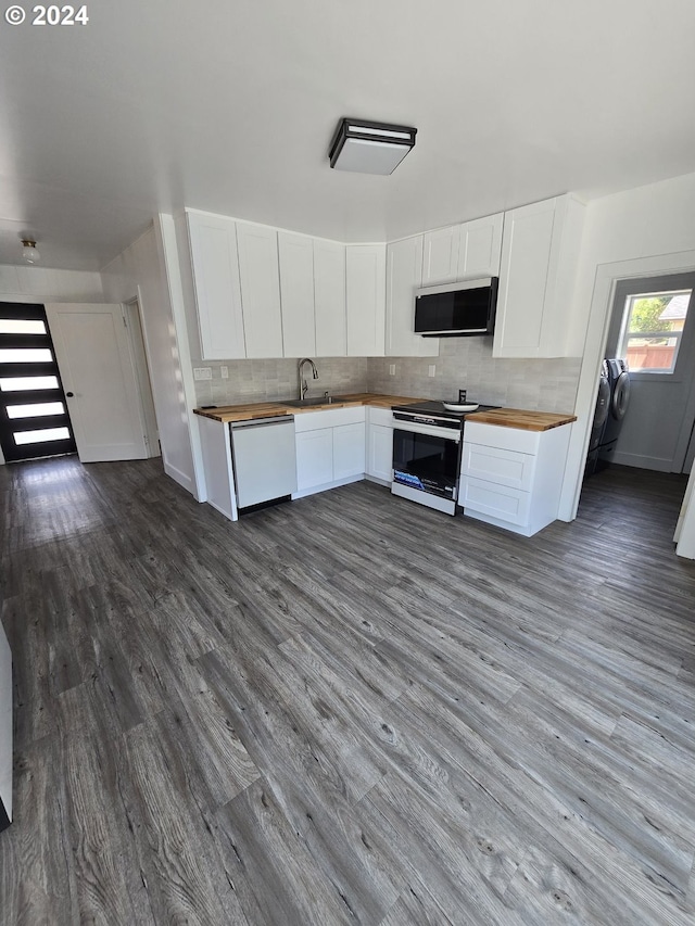 kitchen with white cabinetry, dishwasher, decorative backsplash, and stainless steel range with electric stovetop