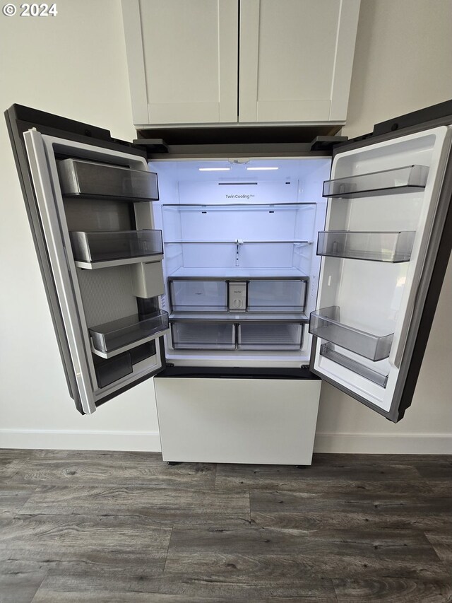 room details featuring white cabinetry and dark hardwood / wood-style flooring