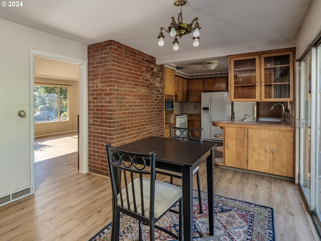 3893 Cedaroak Dr, West Linn, OR 97068 - dining space with a chandelier and light wood finished floors