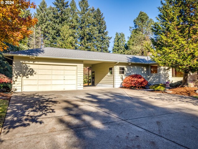 view of front of home featuring a garage and an outdoor structure