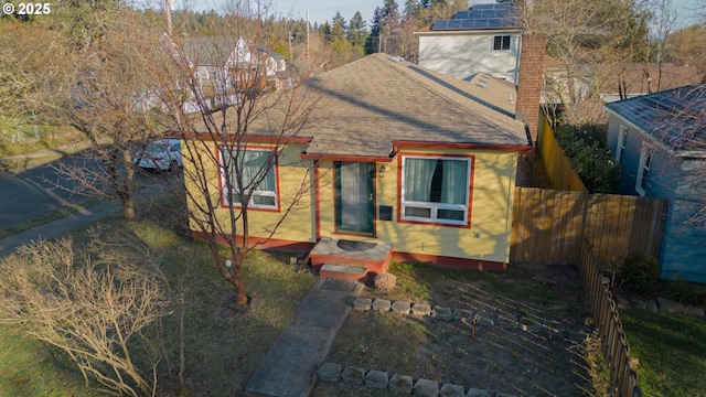 view of front of property featuring solar panels