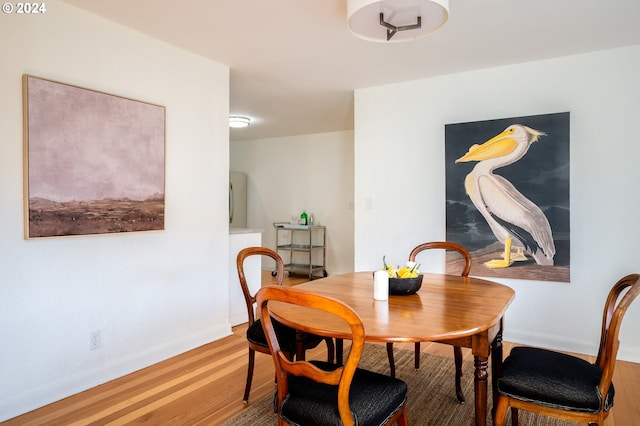 dining area featuring hardwood / wood-style flooring