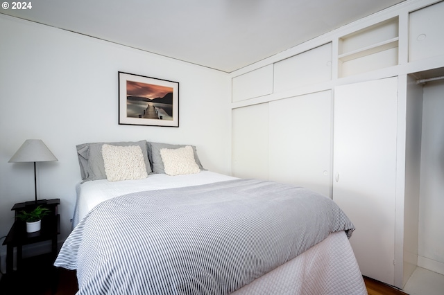 bedroom with hardwood / wood-style flooring