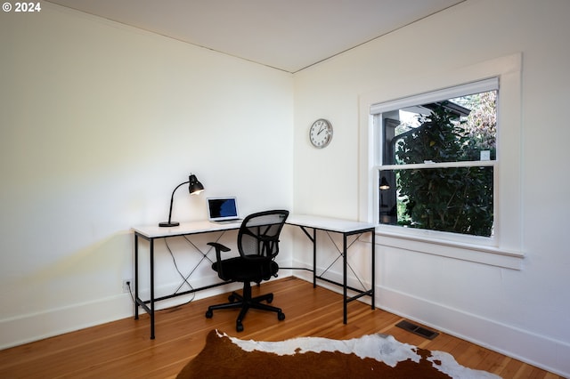 office area with hardwood / wood-style flooring