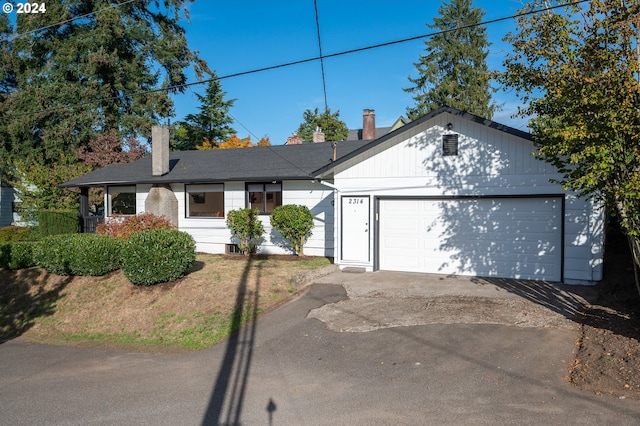 ranch-style house featuring a garage