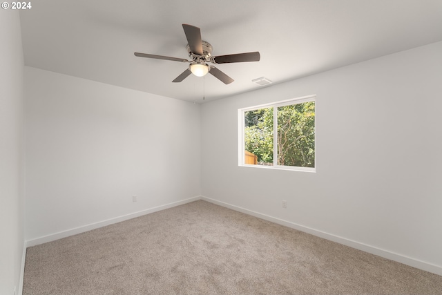 empty room with carpet and ceiling fan