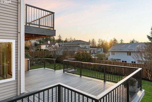 deck at dusk with a yard