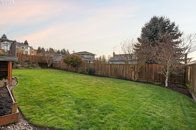 view of yard at dusk