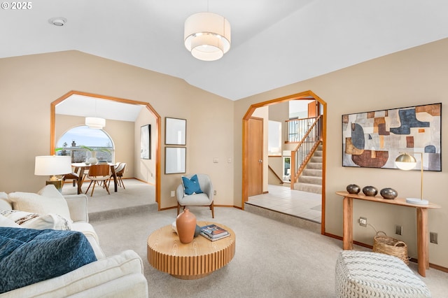 living room with vaulted ceiling and light carpet