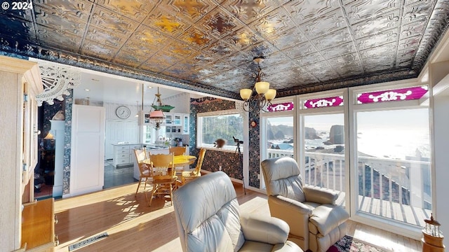 1545 Beach Ave, Brookings, OR 97415 - dining area with an inviting chandelier, a wealth of natural light, and wood-type flooring