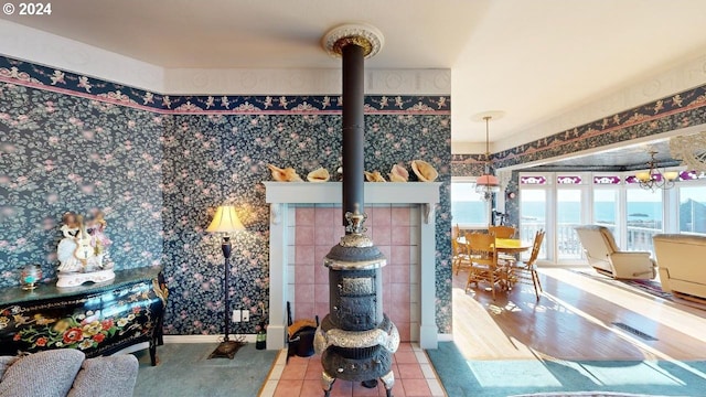 1545 Beach Ave, Brookings, OR 97415 - interior space featuring a water view, a wood stove, and tile patterned floors