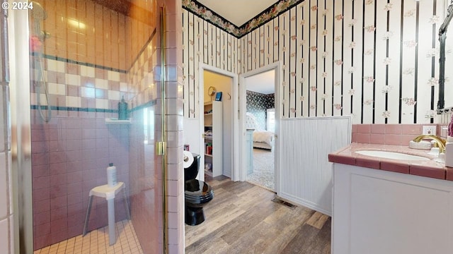 1545 Beach Ave, Brookings, OR 97415 - bathroom with toilet, vanity, hardwood / wood-style floors, and a shower with shower door