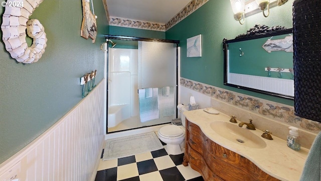 1545 Beach Ave, Brookings, OR 97415 - bathroom featuring toilet, vanity, and a shower with door