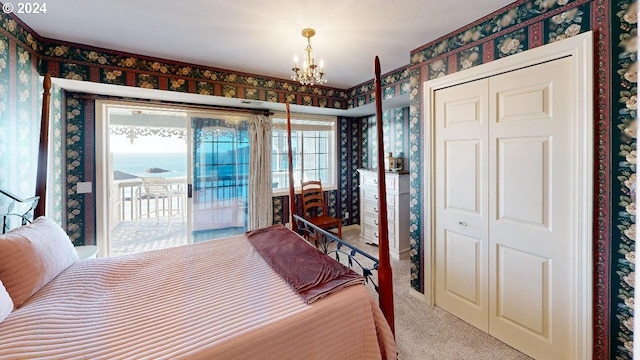 1545 Beach Ave, Brookings, OR 97415 - carpeted bedroom with access to outside and a chandelier