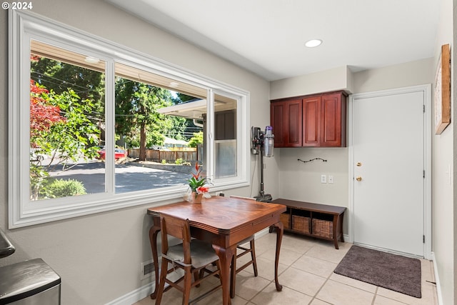 dining space featuring light tile patterned floors