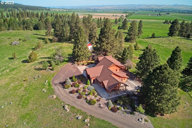 birds eye view of property featuring a rural view