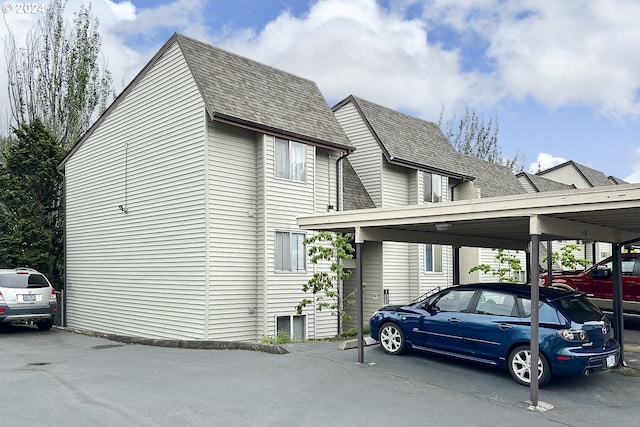 view of parking / parking lot with a carport