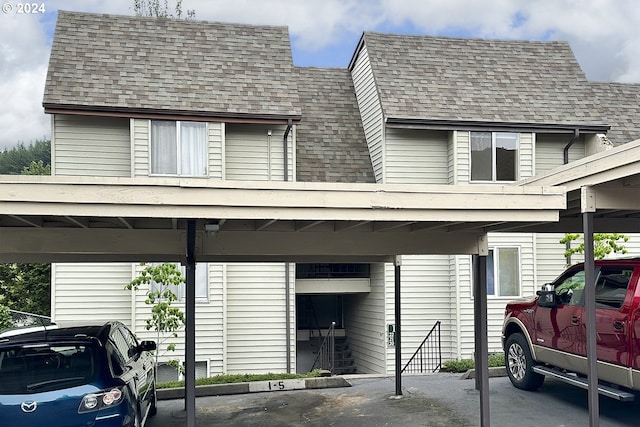 view of parking / parking lot featuring a carport