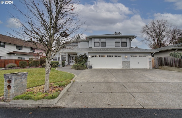 view of front property with a garage and a front lawn