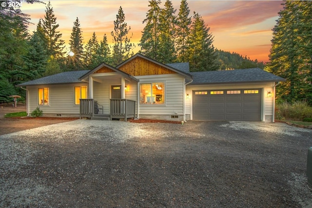 view of front of property featuring a garage and a porch