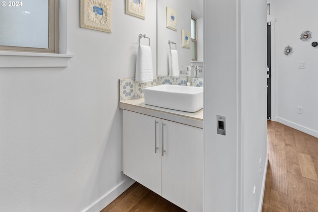 bathroom with vanity and wood-type flooring