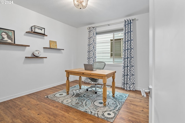 office with light hardwood / wood-style flooring