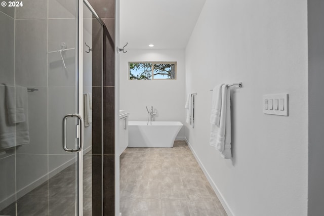 bathroom featuring independent shower and bath