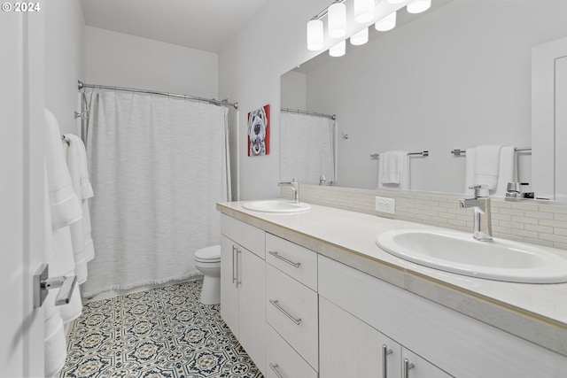 bathroom featuring vanity, curtained shower, tasteful backsplash, and toilet