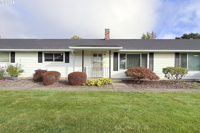 ranch-style home with a front yard