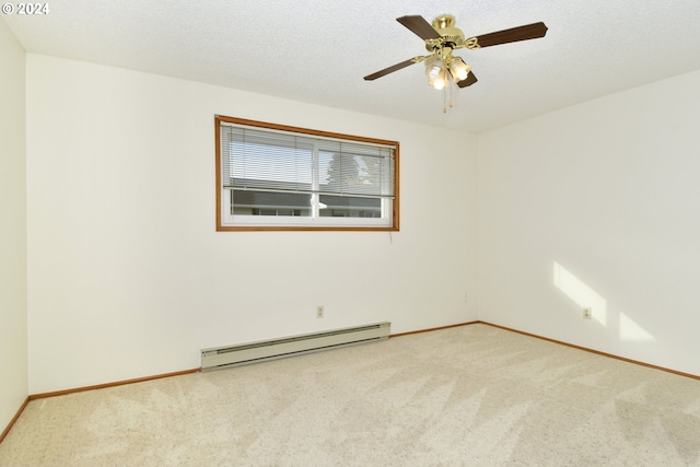 spare room featuring a baseboard heating unit, a textured ceiling, light carpet, and ceiling fan