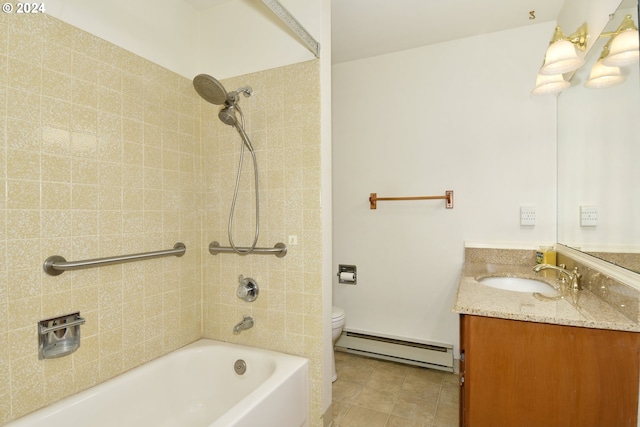 full bathroom featuring tile patterned floors, vanity, tiled shower / bath combo, a baseboard radiator, and toilet