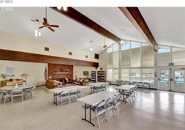 dining area featuring french doors, high vaulted ceiling, ceiling fan, and beam ceiling